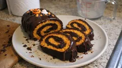 Halloween Pumpkin-Chocolate Swiss Roll: Soft Pumpkin Sponge, Creamy Filling, Cocoa Drizzle